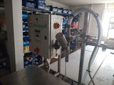 a machine that is sitting in a room with boxes on the floor