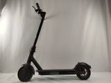 a scooter that is sitting on a white surface