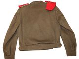 the back of a brown jacket with red trims on a white background