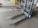 a forklift that is sitting in the middle of the floor