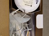 a cardboard box with a clock inside of it