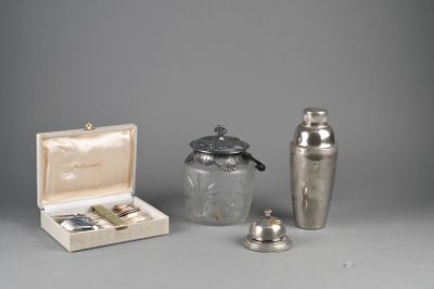 several silver objects are sitting on a table next to each other