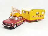 two toy cars that are next to each other on a white surface