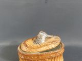 a small wooden box with a bird on top of it