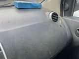 a car dashboard with a blue box on the dashboard