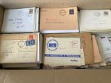 boxes of mail are stacked on top of each other in a cardboard box