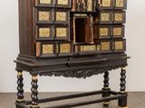 an old wooden cabinet with a mirror on top of it