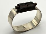 silver cuff bracelet with black beads on a white background