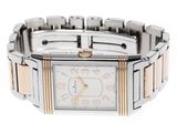 a silver and gold wrist watch with a white face