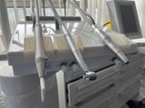 a picture of a hospital room with medical equipment on the table