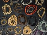a close up of a black bag filled with lots of different colored beads