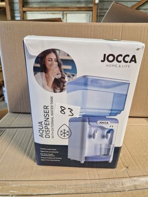 the box of a water purifier is sitting on a cardboard box