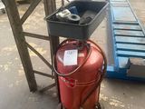 a red fire extinguisor sitting on a cart in a warehouse