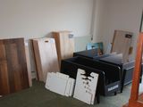 several pieces of wood are stacked on top of each other in a room