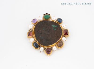 a close up of a coin with a bunch of different colored stones on it