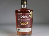 a bottle of whisky sitting on a white surface