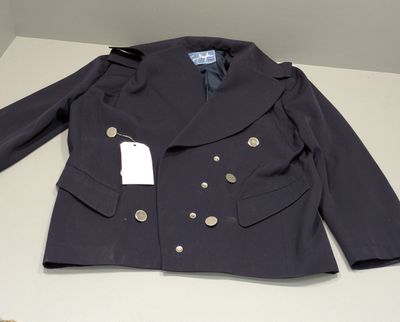 navy blue peale jacket with gold buttons and a tag on the collar