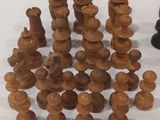 a lot of chess pieces sitting on a table