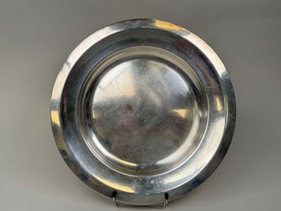 a silver plate that is sitting on a table