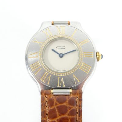 an image of a close up of a wrist watch with roman numerals