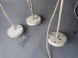 three lamps that are sitting on a table