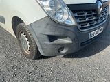 a white van that is parked on the side of the road