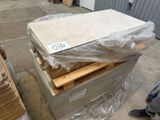 a pile of mattresses sitting on a pallet in a warehouse