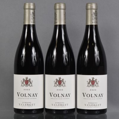 three bottles of wine sitting on top of a table next to each other