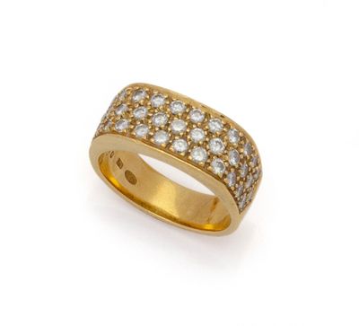a gold and diamond band ring