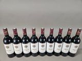 six bottles of red wine lined up in a row