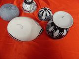 three bowls and a ball of yarn sitting on a table