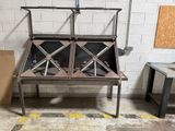 a metal table that has a metal structure on top of it