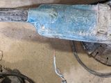 an image of a close up of a drill on a table