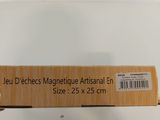 someone is holding a box of magnets in their hand