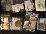 a lot of coins that are sitting on a table