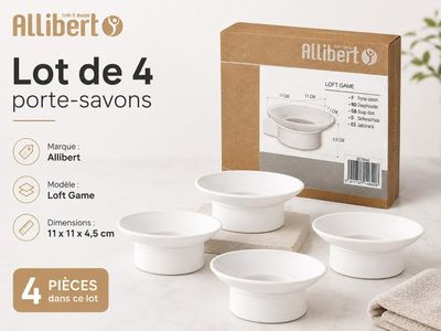 four white bowls are sitting on a table in front of a box