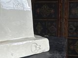 a statue of a cat sitting on top of a table