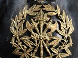 helmet of a soldier with a wreath on the side of it