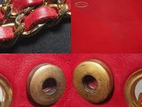 two pictures of a red purse with a gold chain and a red purse with a gold chain