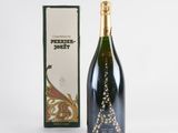 a bottle of champagne next to a box on a white surface