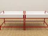 pair of red and white coffee tables with glass tops