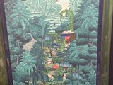 tableau encadré représentant une cascade dans une forêt