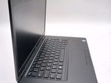 a laptop computer that is sitting on a white surface