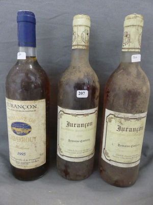 three bottles of wine sitting next to each other on a table