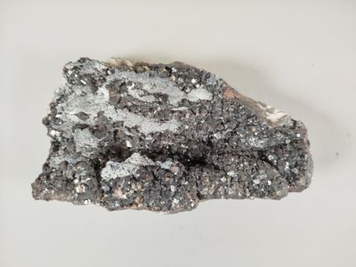 an image of a piece of rock on a white surface