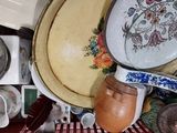 a basket full of dishes and bowls in it