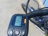 a close up of a bike ' s handlebar with a speedometer