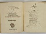 an open book with writing on it sitting on a table