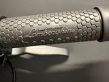 a close up of a bike handle with a black and white photo