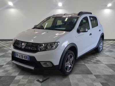a picture of a white dacia parked on a checkered floor